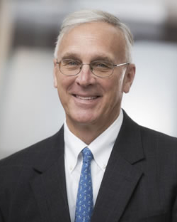 Portrait of C. Michael Cassidy in a gray suit