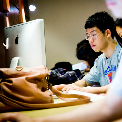 Emory student looking at a computer screen